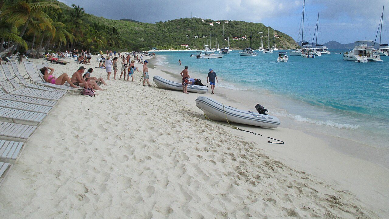 White Bay on Jost Van Dyke, with dinghies on the sand and yachts at anchor