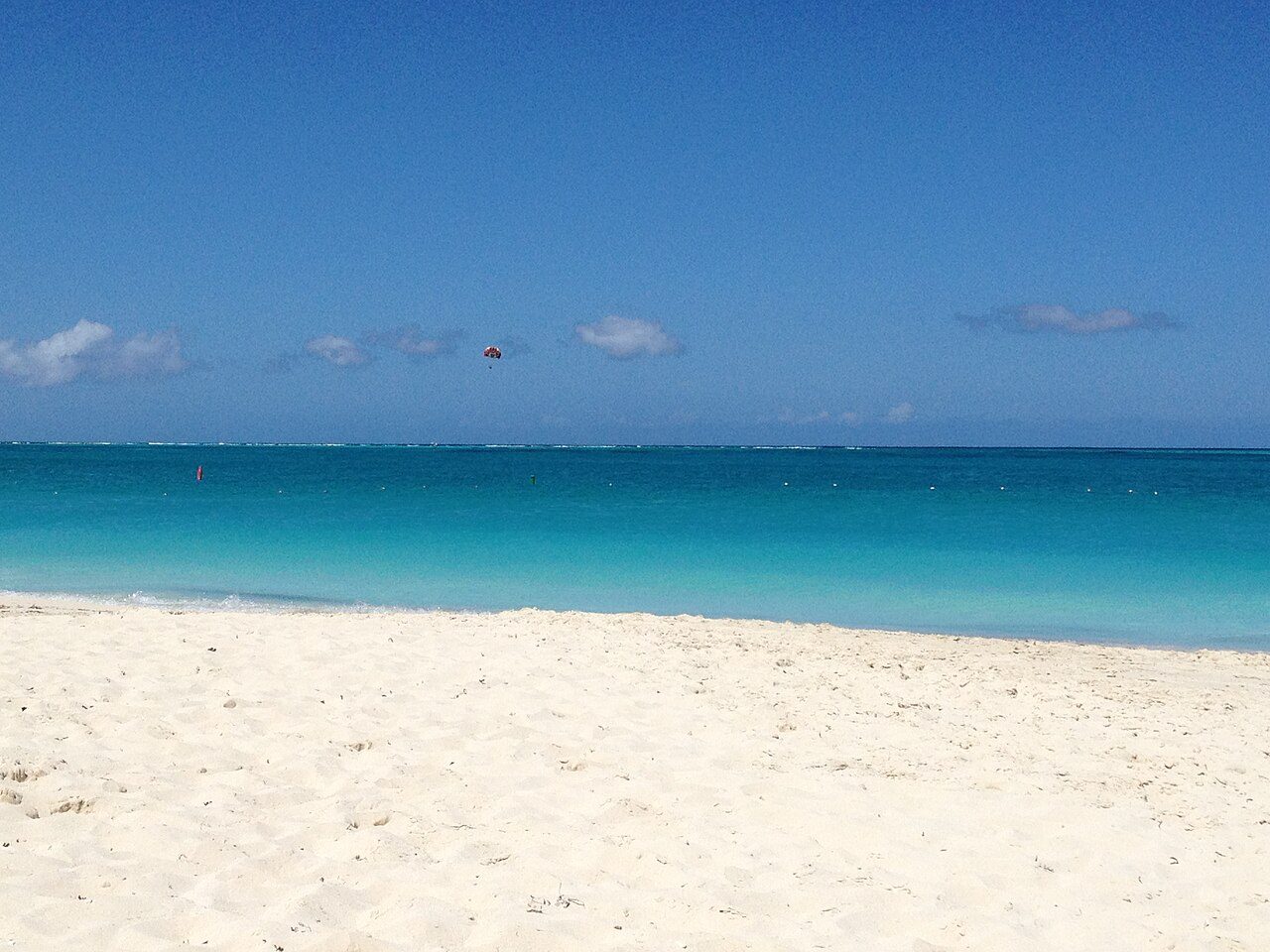 Grace Bay's white sand and layered turquoise water on Providenciales