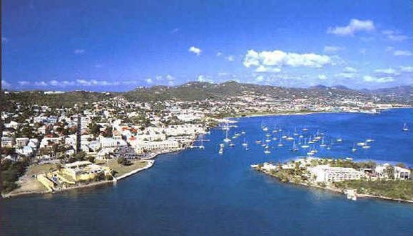 Christiansted's waterfront and fort from the air, with boats moored in the turquoise harbour